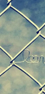 Artistic fence with 'love' word and blue-gray background.