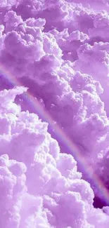 Dreamy lavender clouds with a rainbow in the sky.