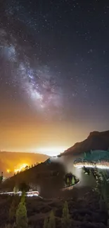 A stunning night skyline with a galaxy view over mountainous terrain.