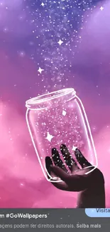 Hand holding a glowing jar of stars against a purple sky.