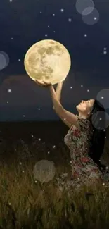 Woman holding glowing moon in dark field.