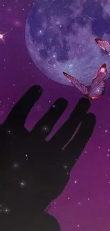 Hand reaching for butterflies under a violet moonlit night sky.