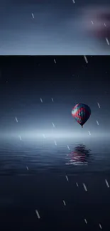 Night sky with hot air balloon over calm ocean.