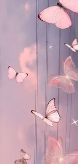 Dreamy wallpaper with pink butterflies on a pastel sky.