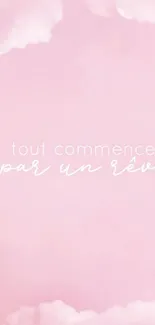 Pastel pink wallpaper with dreamy clouds and inspirational French quote.