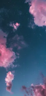 Dreamy pink clouds and night sky with stars.