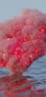 Whimsical pink cloud over ocean with glowing stars.