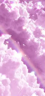 Dreamy pink clouds with a glimmering rainbow, perfect for a phone wallpaper.