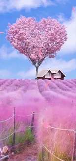 Pink heart-shaped tree and lavender field under blue sky, creating a dreamy landscape.