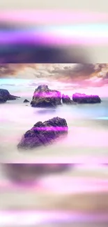 Dreamy pink seascape with rocks and misty waters.