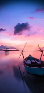 Peaceful pink sunset with a boat on calm waters.