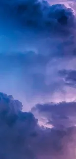 Purple and blue clouds in a dreamy sky wallpaper.