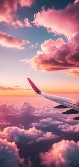 Airplane wing under vibrant pink sunset clouds.