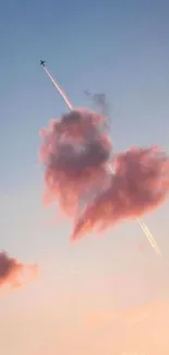 Heart-shaped pink cloud with jet in pastel sunset sky.