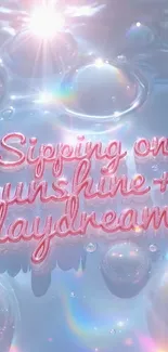 Dreamy bubbles and text saying 'Sipping on sunshine + daydreams'.