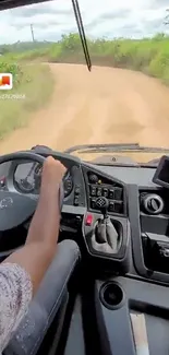 View from inside a vehicle driving along a scenic countryside road.