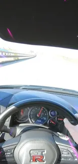 POV shot inside a GT-R driving at high speed on an open road.