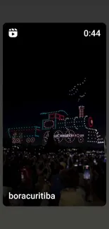 Dazzling drone light show captivating a crowd at night.