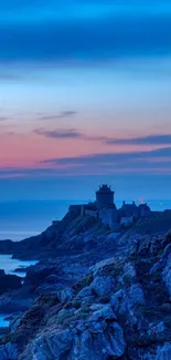 Dusk coastline with rocky cliffs and vibrant sunset sky.