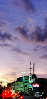 Urban landscape at dusk with vibrant sky colors and city lights.