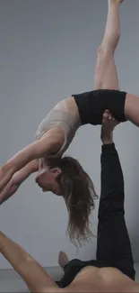 Acrobatic yoga pose showcasing balance and strength.