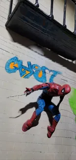 Superhero figure leaping on graffiti brick wall.