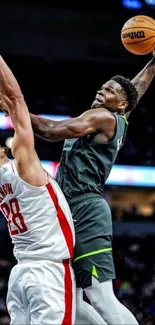 Intense basketball game action shot with players.