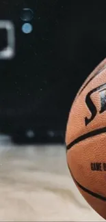 Close-up of a basketball on a court with blurred background, perfect for sports fans.