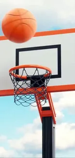 Basketball approaching hoop against a blue sky.