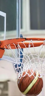 Basketball swishing through a hoop with net in a dynamic action shot.