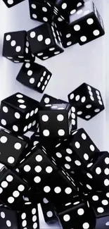 Black dice scattered on a white surface making a striking pattern.