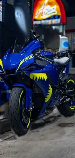 Dynamic blue motorcycle at night with neon lights in an urban setting.