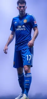 Soccer player in blue uniform on a dynamic background.