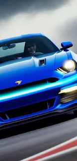 Blue sports car on racing track with a dynamic design.