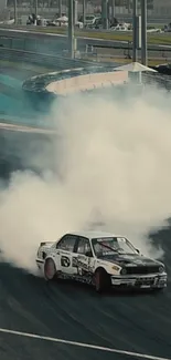 Car drifting on track with smoke clouds, capturing high-speed action.