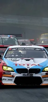 A dynamic car racing scene with sports cars on track.