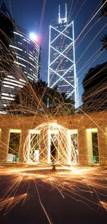 Urban night skyline with sparklers and skyscrapers in vibrant lights.