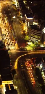 Aerial view of vibrant city streets at night.