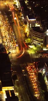 Dynamic cityscape with vibrant lights and traffic captured at night.