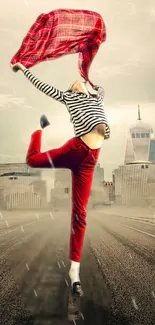 Dancer in vibrant red against a city skyline, epitomizing freedom and motion.