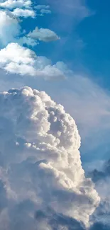 White clouds against vibrant blue sky wallpaper.