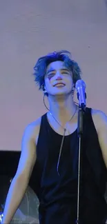 Energetic artist performing live on stage with microphone, vibrant atmosphere.