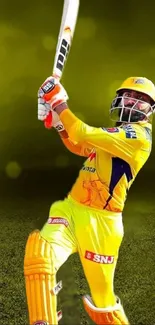 Cricket batsman in yellow hitting shot with blurred green background.