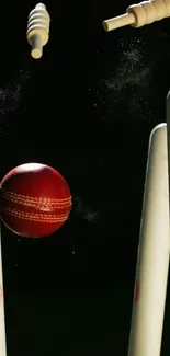 Cricket ball hits stumps with bails flying.