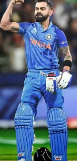 Cricket player in blue attire, celebrating a moment on the field.