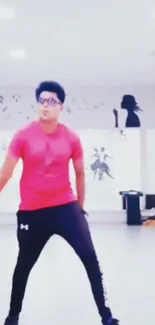 Person dancing energetically in a studio room with vibrant decor.