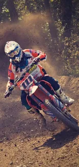 Motocross rider speeding on dirt track.