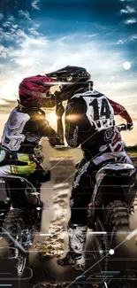 Two dirt bikers racing under a blazing sunset on rugged track.