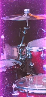 Red and silver drum set on stage, ready for a live performance.