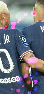 Football players in navy jerseys showing teamwork.